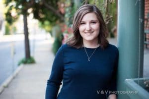 Lexis, the blogger, leaning against a porch in Lititz, PA