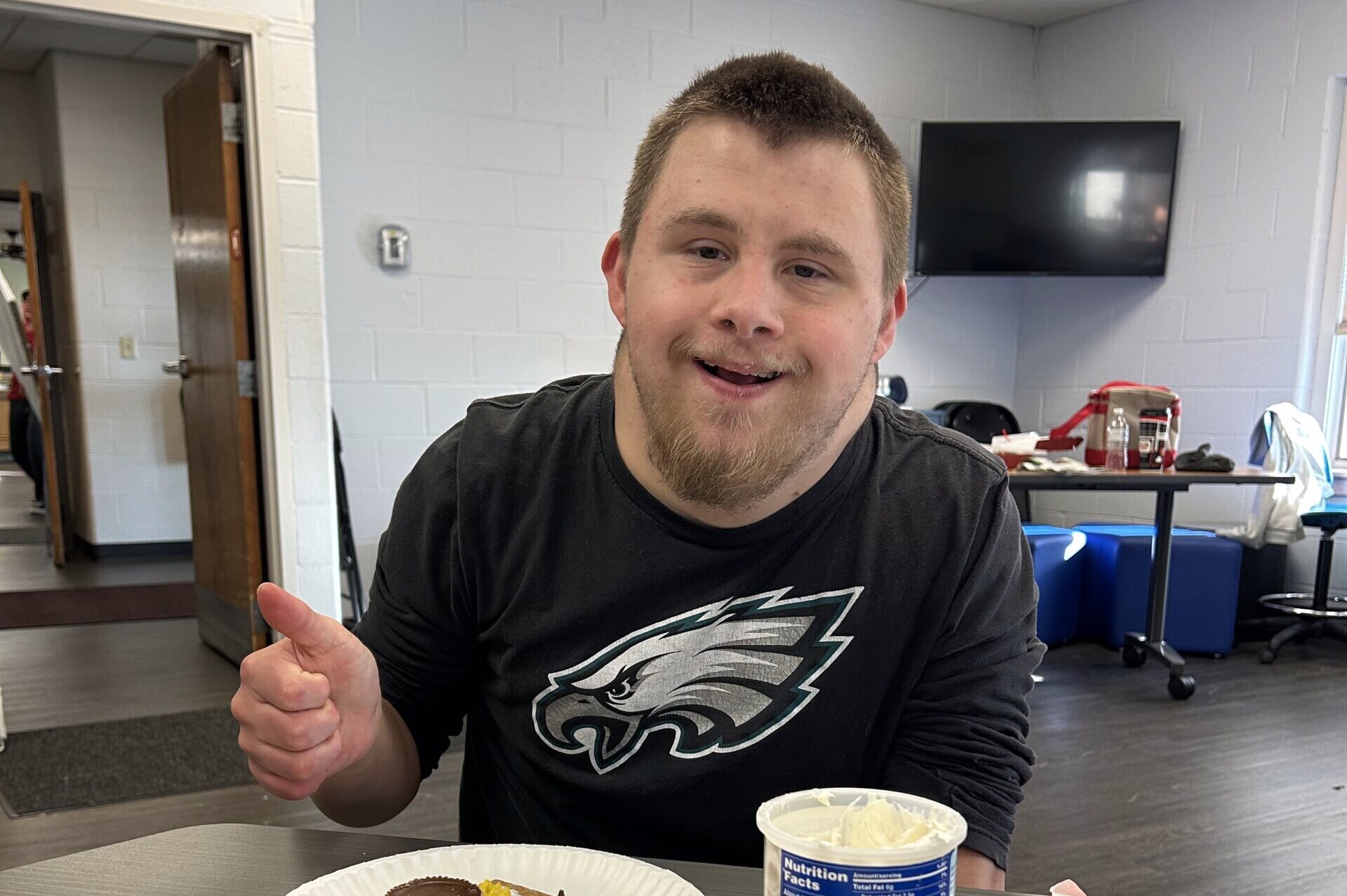 CLS Participant having fun during a gingerbread house making activity