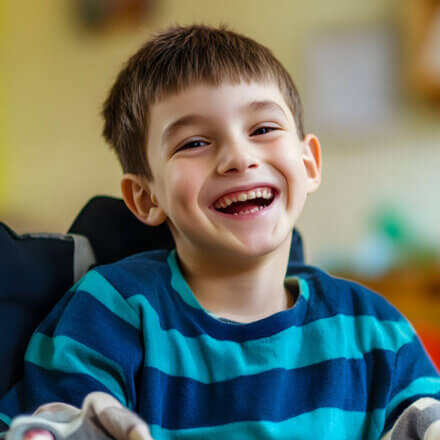 Boy Smiling In Wheelchair
