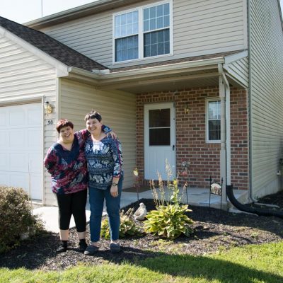 two women standing outside of a Lancaster County home