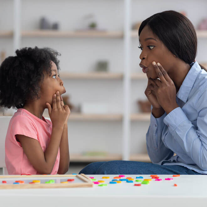 Girl Practicing Speech Therapy
