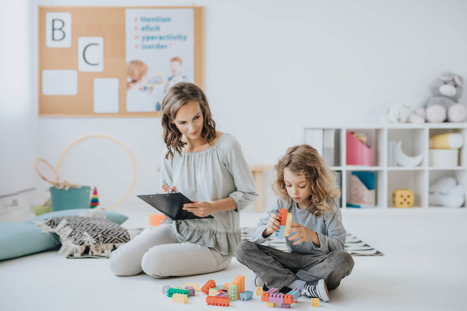 Woman With Clipboard With Child 1