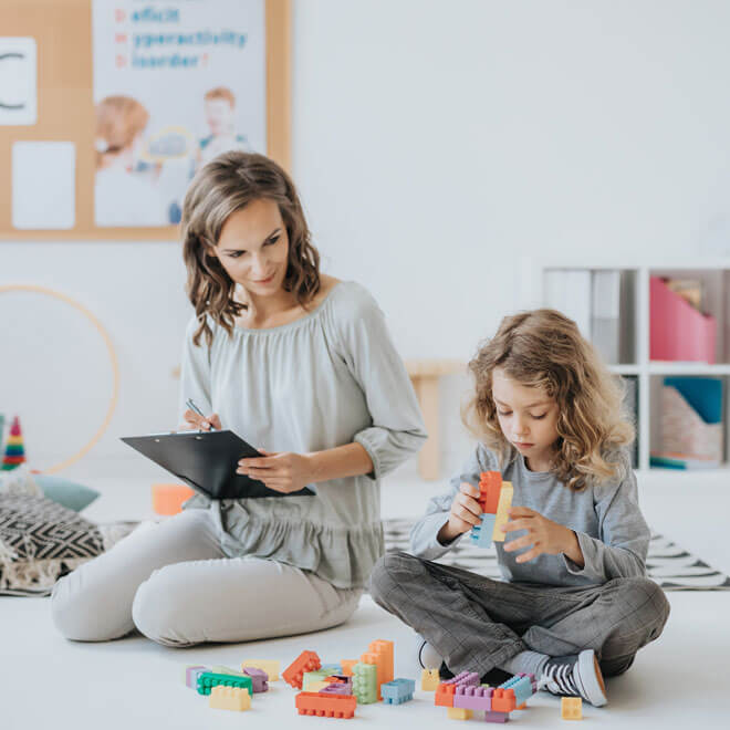 Woman With Clipboard With Child